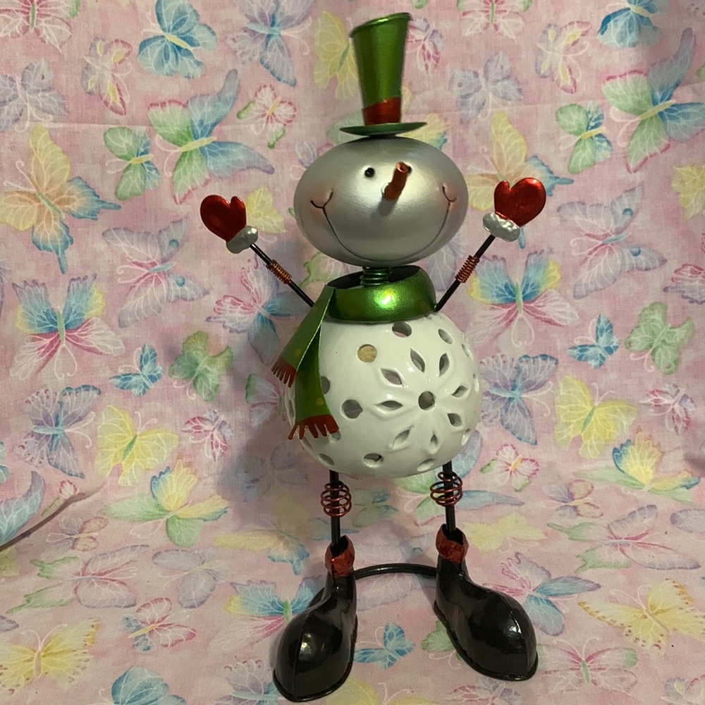 Small bobble head snowman 13” h votive holder. Use LED votive candles only.